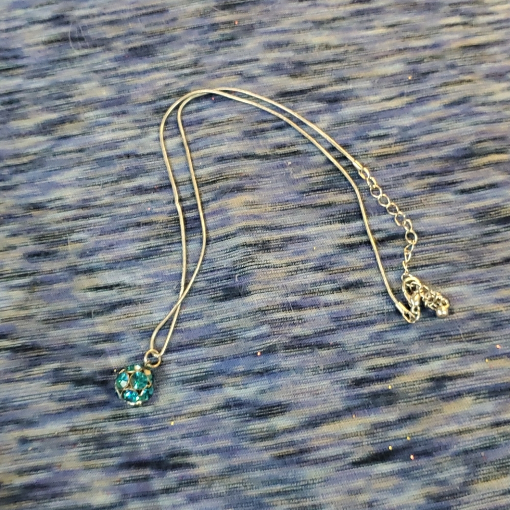 Necklace with blue sparkly  ball